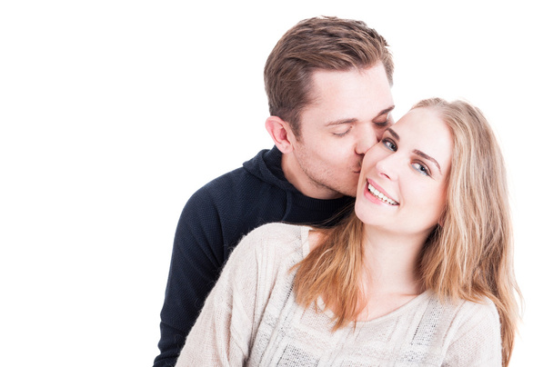 Man kissing on cheek her beautiful lady  - Photo, Image