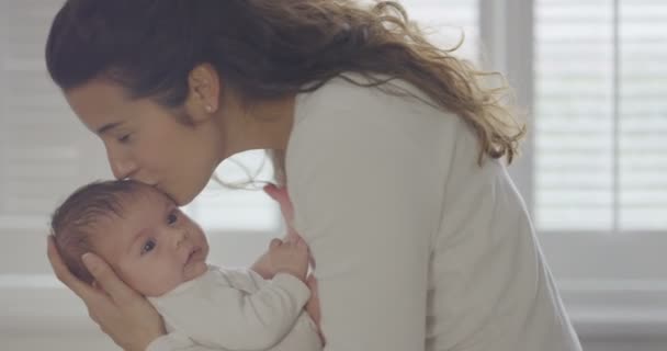 mother holding baby daughter - Felvétel, videó
