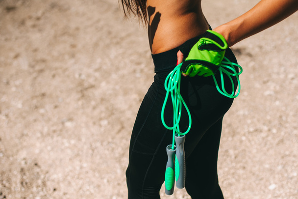 Sportive girl with jumping rope - Foto, Imagen