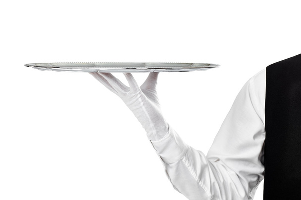 Elegant waiter holding silver tray - Fotó, kép