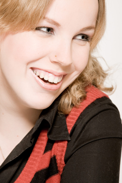 Portrait of a laughing blond curly woman - Foto, afbeelding