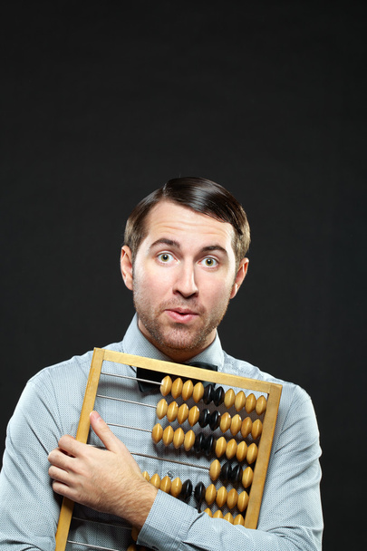 Accountant holding an abacus   - Photo, Image