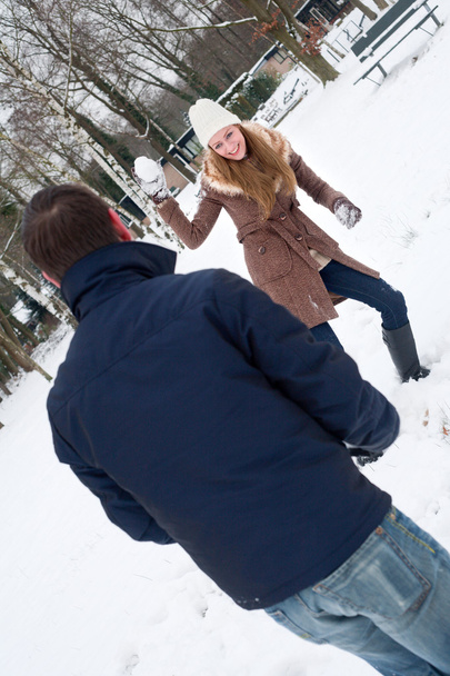 couple having a snowball fight - Fotografie, Obrázek