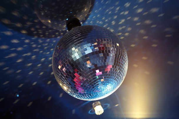 Sparkling evening ball at disco party - 写真・画像