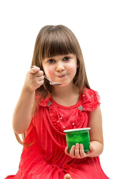 meisje eten yoghurt - Foto, afbeelding