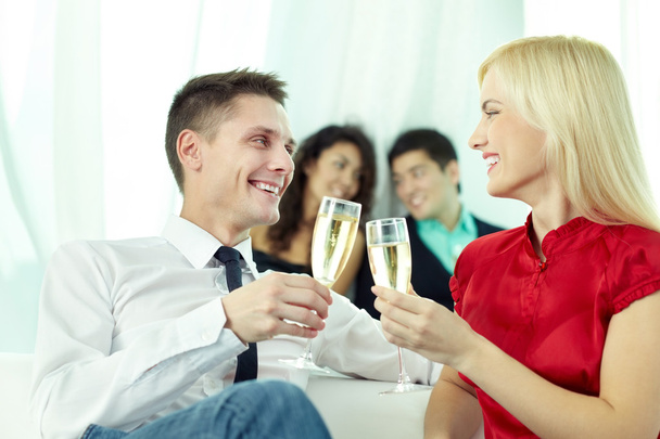 man and woman toasting with champagne flutes - Фото, зображення