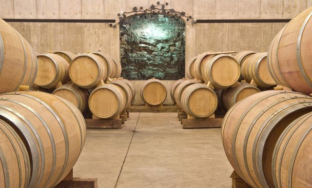 Stack of Wine Barrels in a Cellar - Photo, Image