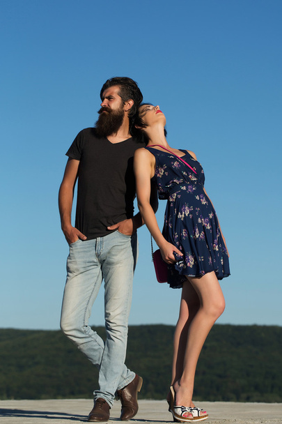 Couple pose on blue sky - Fotoğraf, Görsel