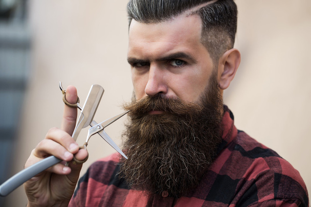 Man hipster with scissors - Foto, afbeelding