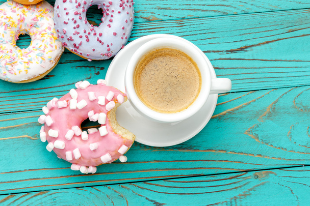 Donuts on colorful wooden background - Photo, Image