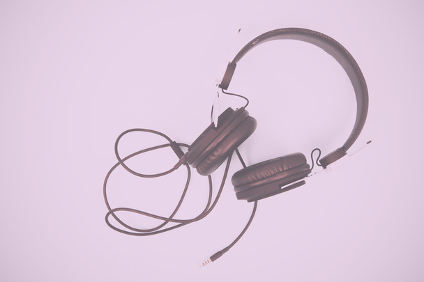 Black headphones against a light coloured background Vintage Ret - Photo, Image