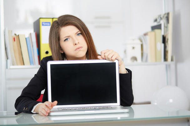 unsuccessful businesswoman showing blank screen laptop - Photo, image