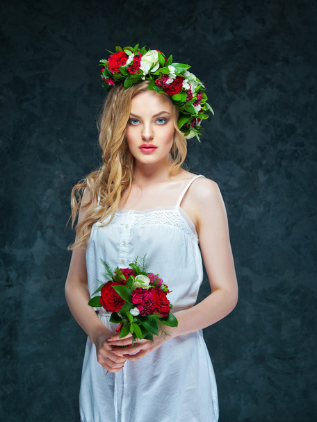 beautiful blonde girl in a wreath of flowers - Foto, Imagem