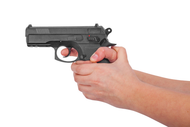 kéz kezében egy fegyvert elszigetelt fehér háttér - Fotó, kép