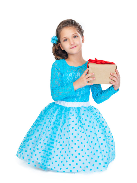 kislány a smart ruha és frizura, egy ajándék gazdaság - Fotó, kép