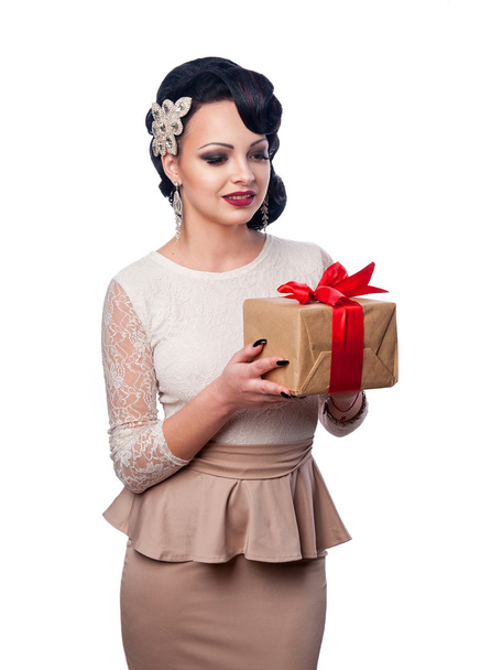 beautiful girl in evening dress holding a gift - Photo, Image