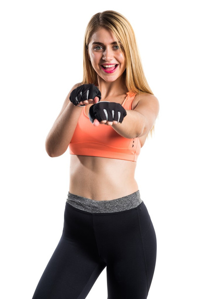 Sport woman giving a punch - Фото, зображення
