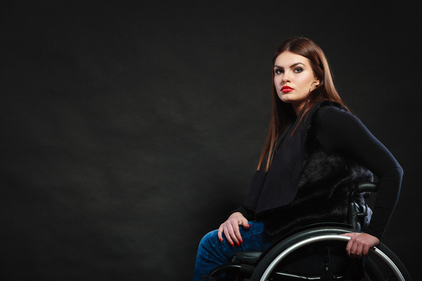 Sad girl on wheelchair. - Фото, изображение