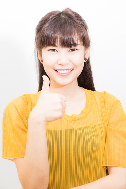 Азіатських жінок, показав великий палець вгору білі, відчувати себе добре - Фото, зображення