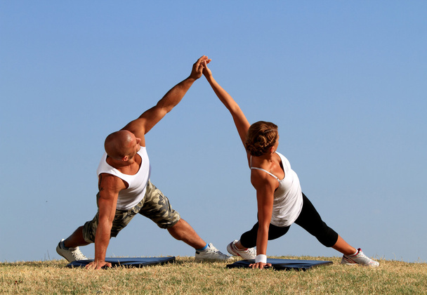 Couple doing yoga - Photo, Image