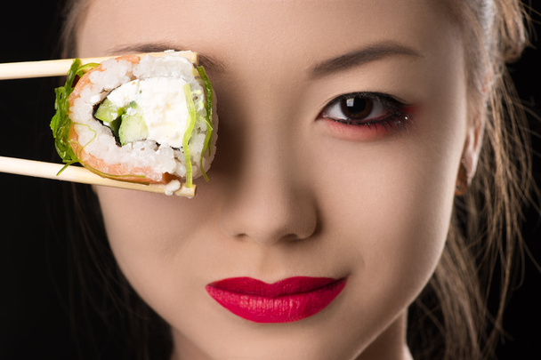 beautiful Korean girl with roll instead eyes - Foto, imagen