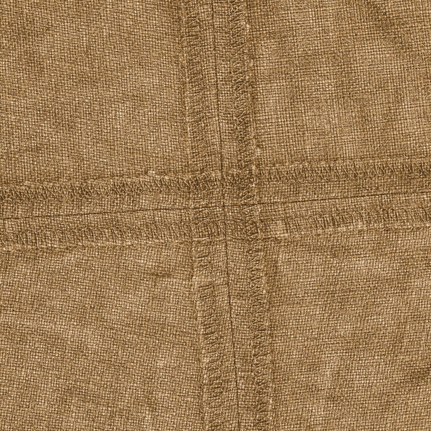 yellowish-brown denim texture,wrong side, back seams - Foto, imagen
