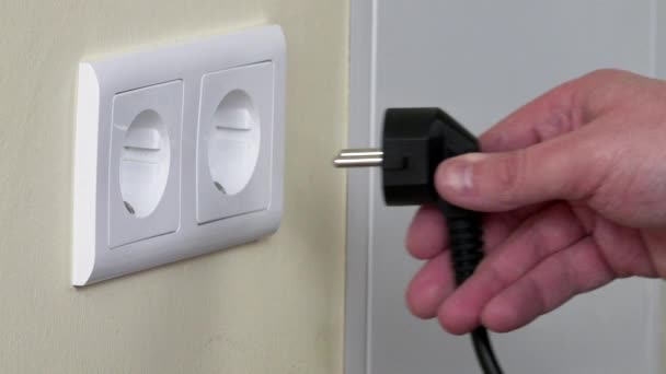 Hand Plug Into Electricity Socket - Footage, Video