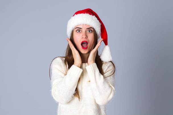 Woman in red christmas hat - Photo, Image