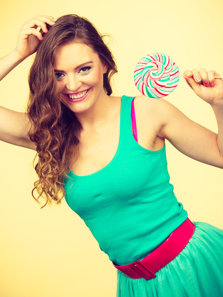 Woman charming girl with lollipop candy - Foto, Imagem