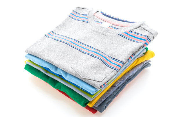 Stack of T shirts and polo shirts  - Photo, Image