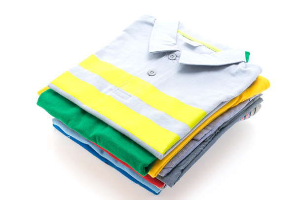 Stack of T shirts and polo shirts  - Photo, Image