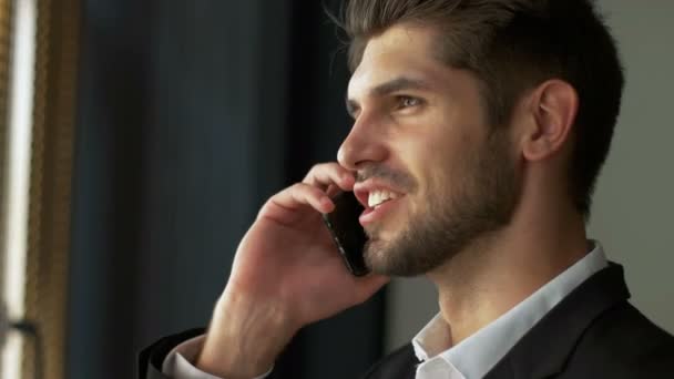 Successful businessman using his mobile phone. - Felvétel, videó