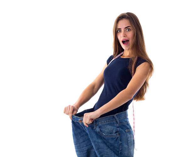 多くのより大きいサイズのジーンズを着ている女性 - 写真・画像