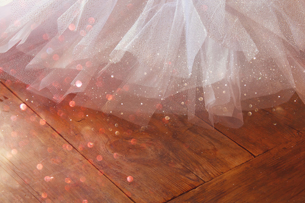 White ballet tutu on wooden floor - Photo, image
