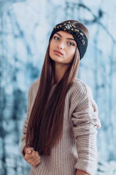 young  woman in warm headband - 写真・画像
