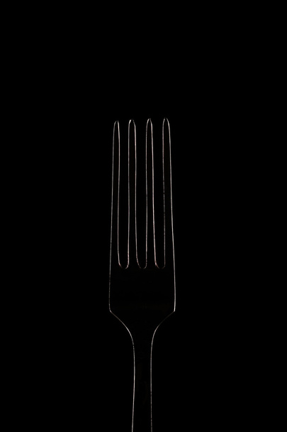 Glowing white contour fork on black background, outline - Zdjęcie, obraz