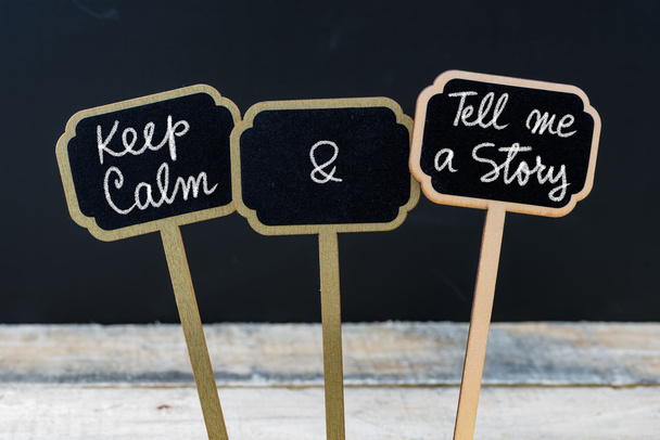 Keep Calm and Tell Me A Story message written with chalk on mini blackboard labels - Photo, Image