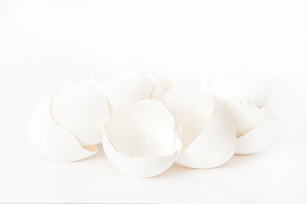 White eggshells on a white background isolated - Foto, imagen