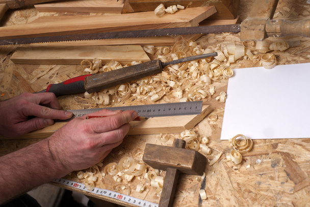 Carpenter tools on wooden table with sawdust. - Photo, Image