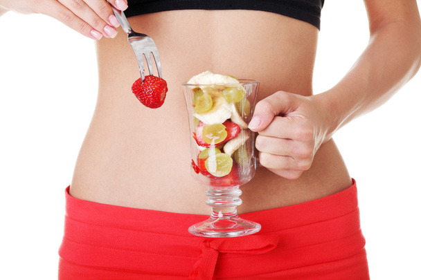 Pretty fit belly and fruit salad - Foto, Imagen