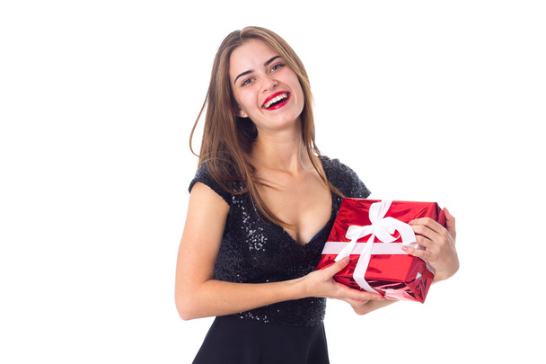 Young woman holding a present - Фото, изображение