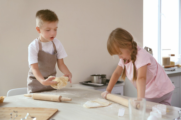 Kids making biscuits in kitchen - Photo, image