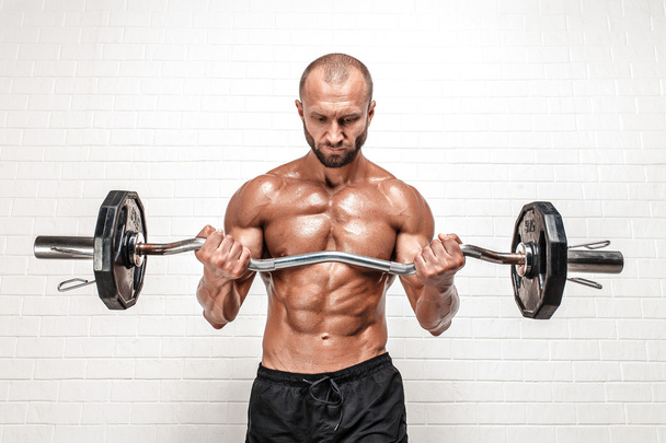 Strong man with weight bar - Foto, Bild