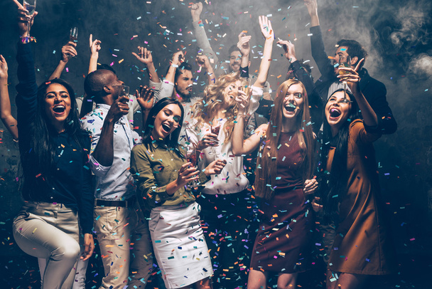 people dancing at party with confetti - 写真・画像
