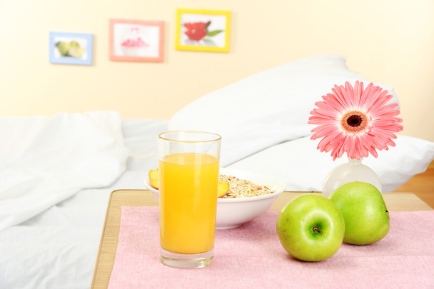 light breakfast on the nightstand next to the bed - Fotografie, Obrázek