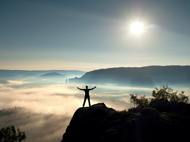 Happy man gesture of triumph with hands in the air. Funny hiker with raised arm - Photo, Image