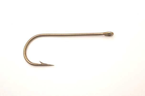 Fishing hook on a white paper background - Photo, Image