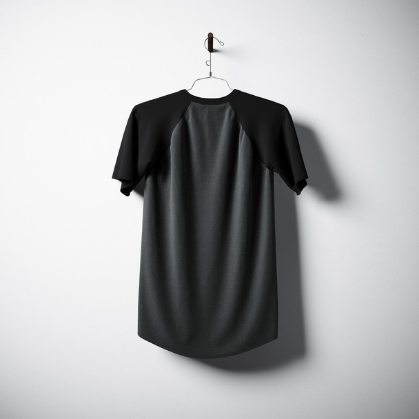 Blank cotton tshirt of black and gray colors hanging in center empty concrete wall. Clear label mockup with highly detailed textured materials. Square. Back side view. 3D rendering. - Foto, Bild