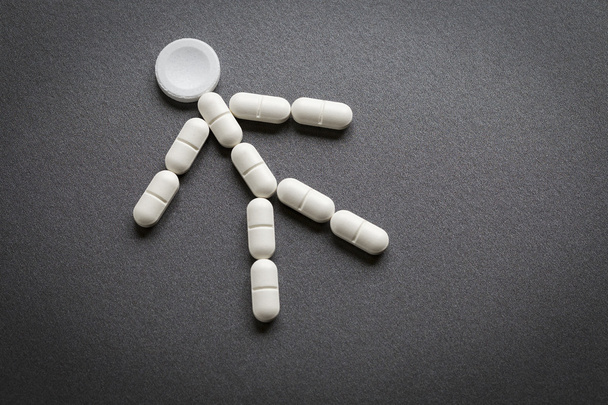 Homem analgésico, medicamentos em forma de comprimido
 - Foto, Imagem