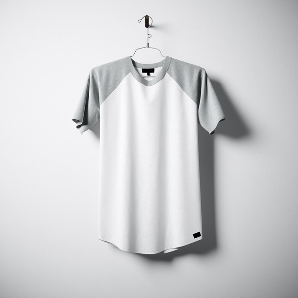 Blank cotton tshirt of white and gray colors hanging in center empty concrete wall. Clear label mockup with highly detailed textured materials. Square. Front side view. 3D rendering. - Photo, Image